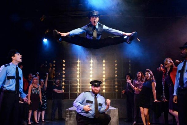 That's Caleb Donahoe doing the splits in mid-air during the final scene of "The Full Monty"
